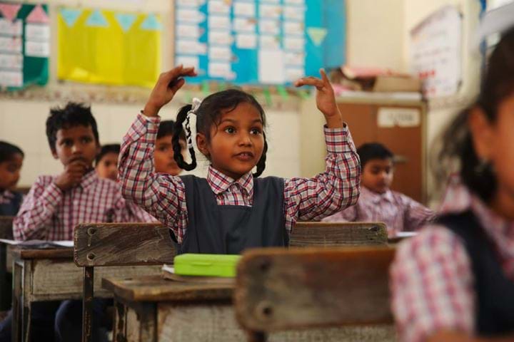Girl in classroom, India