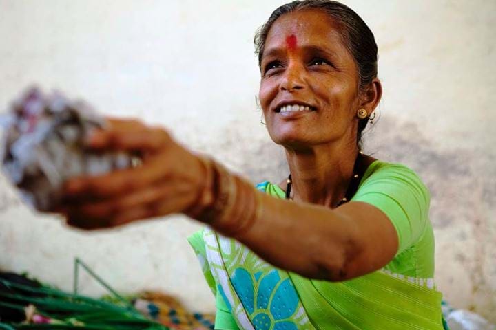 Smiling woman wearing bindi, India