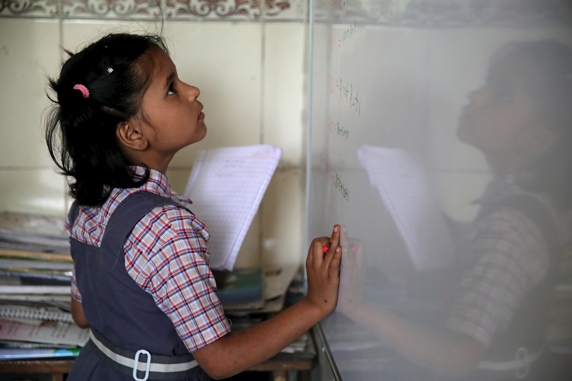 Young girl at whiteboard, India 