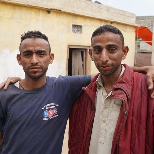 Two brothers arm in arm, Pakistan