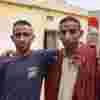 Two brothers arm in arm, Pakistan 