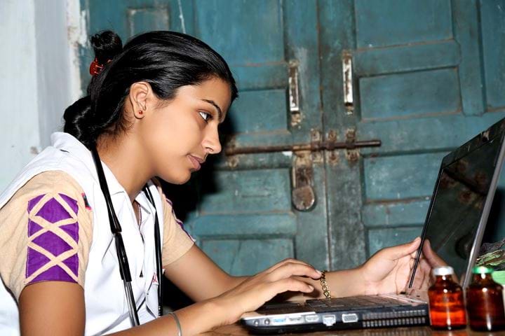 Girl at laptop, India 