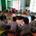 classroom of children on a round table 