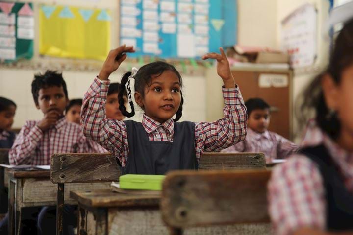 young girl interacting in classroom 