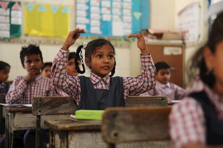 young girl interacting in classroom